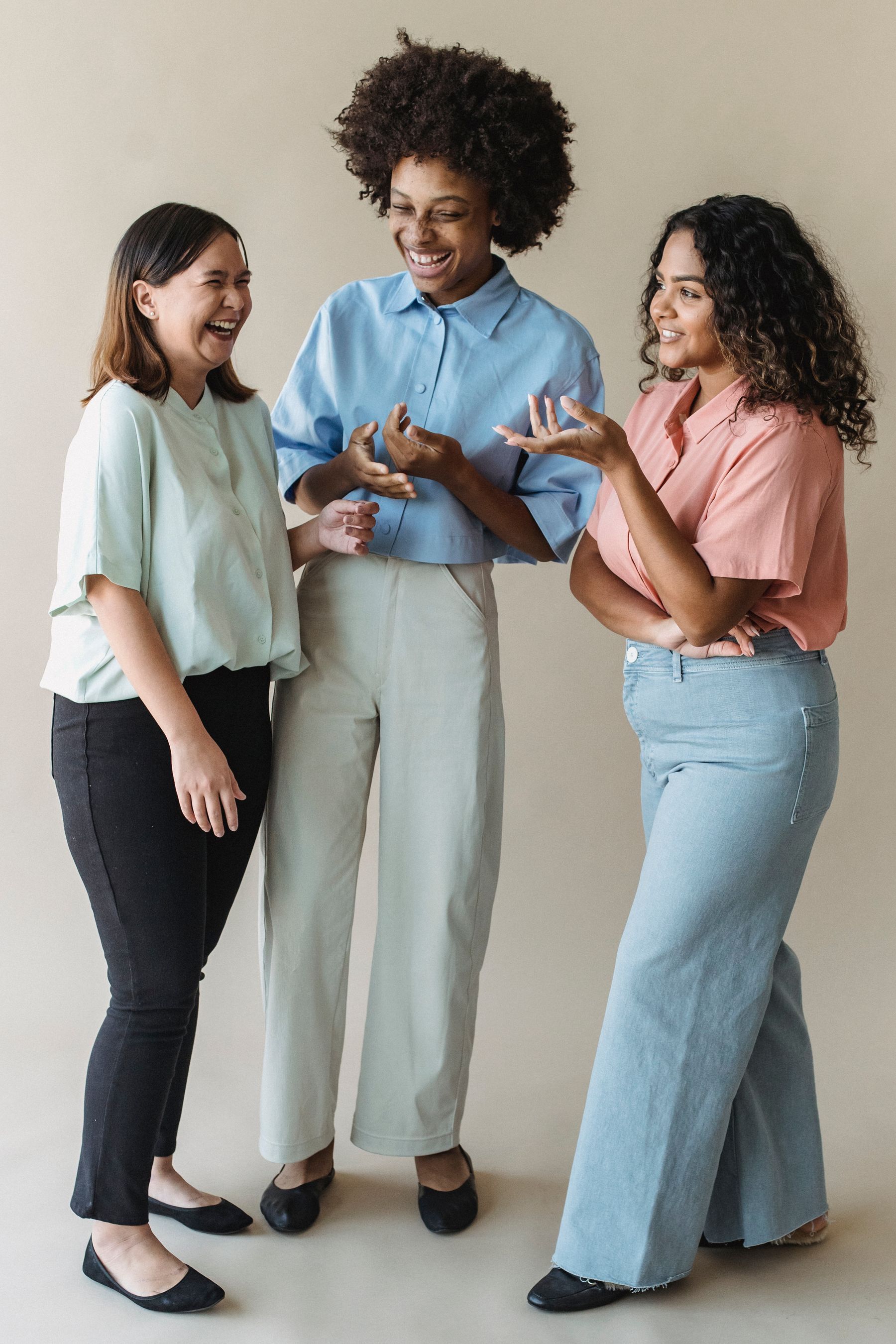 Three women laughing together